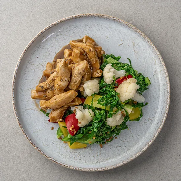 Baked chicken with peppercorn sauce and sauteed spinach veggies
