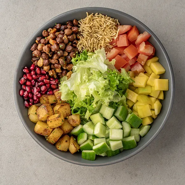 Black Channa and roasted potato chaat salad with Green chutney dressing