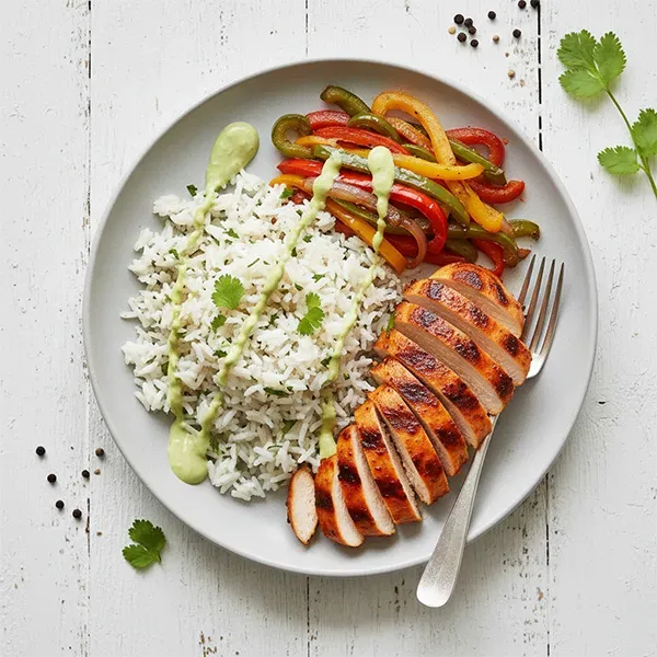 Chipotle Adobo Chicken with Herb Rice, Fajita Peppers & Creamy Avocado Sauce