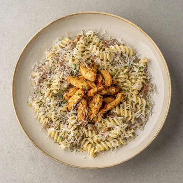 Creamy pasta carbonara with paprika-grilled chicken