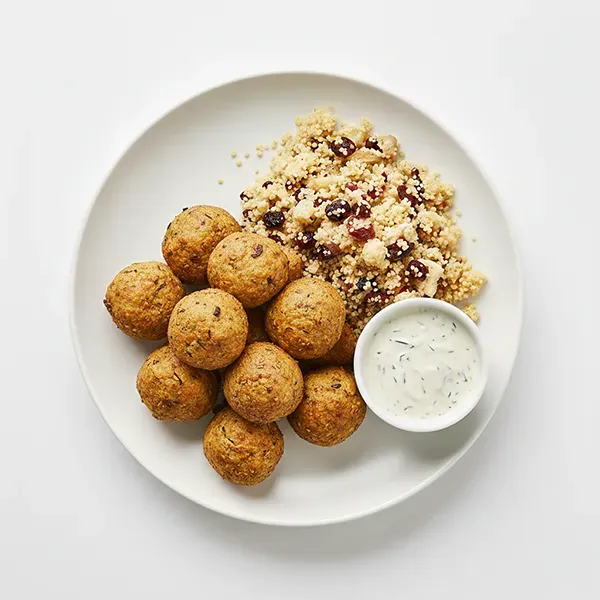 Gulf spiced tofu Kofta with berry cous cous and garlic tahini sauce