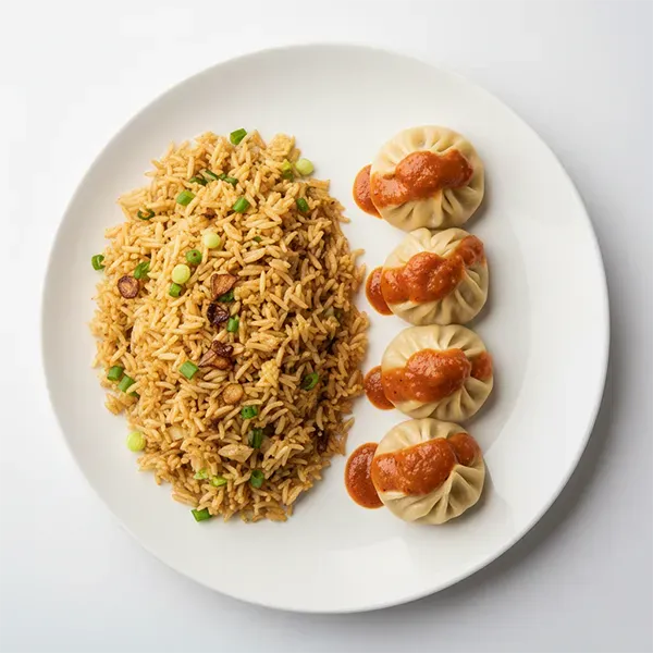 Paneer dumplings with tangy chili sauce and garlic fried rice