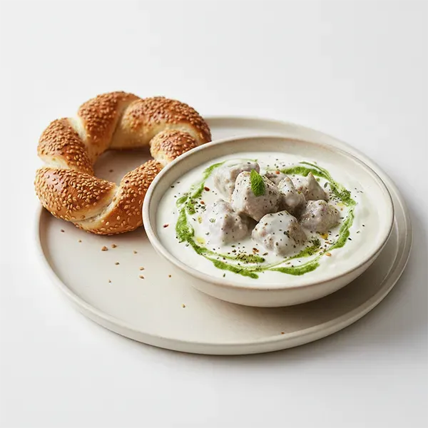 Silky Syrian Lamb Shakriya with Mint-Infused Yogurt & Hand-Crafted Simit