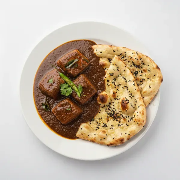 Tikhari Macchi with Sesame Naan